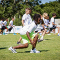Young-athletes-taking-part-in-stretches-ahead-of-drills-at-the-Jaydon-Hodge-More-Than-An-Athlete-Football-Camp.