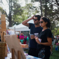 free-photo-of-people-standing-by-the-handmade-art-exhibition-at-the-market