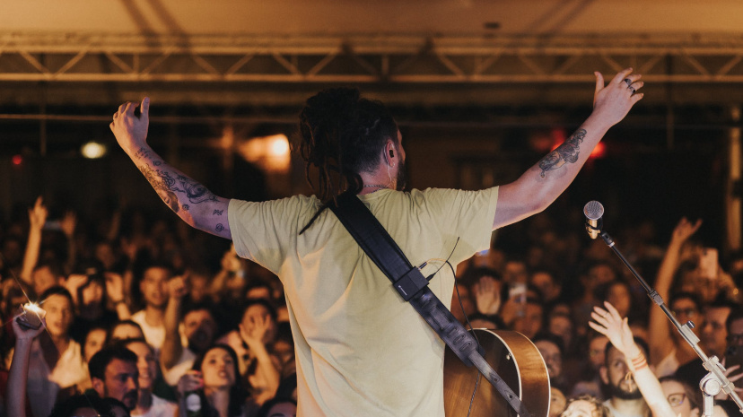free-photo-of-back-view-of-a-musician-on-a-stage-with-arms-raised-towards-the-audience.jpeg?auto=compress&cs=tinysrgb&w=1260&h=750&dpr=2.jpg