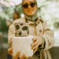 free-photo-of-smiling-woman-holding-handmade-clay-cup-and-bowl