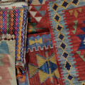 free-photo-of-a-collection-of-kilim-rugs-one-with-a-geometric-design