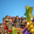 free-photo-of-four-women-are-riding-on-a-carnival-ride
