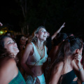 free-photo-of-smiling-women-at-concert-at-night
