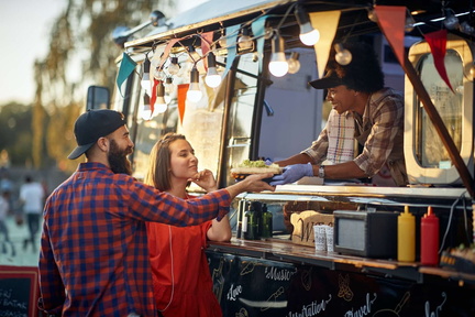 Couple-purchasing-food-from-a-food-truck-window-1536x1024