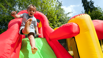 kid at inflatable