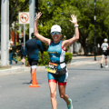free-photo-of-a-woman-in-a-triathlon-outfit-is-crossing-the-finish-line