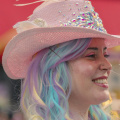 free-photo-of-portrait-of-a-woman-with-colorful-dyed-hair-wearing-a-pink-hat